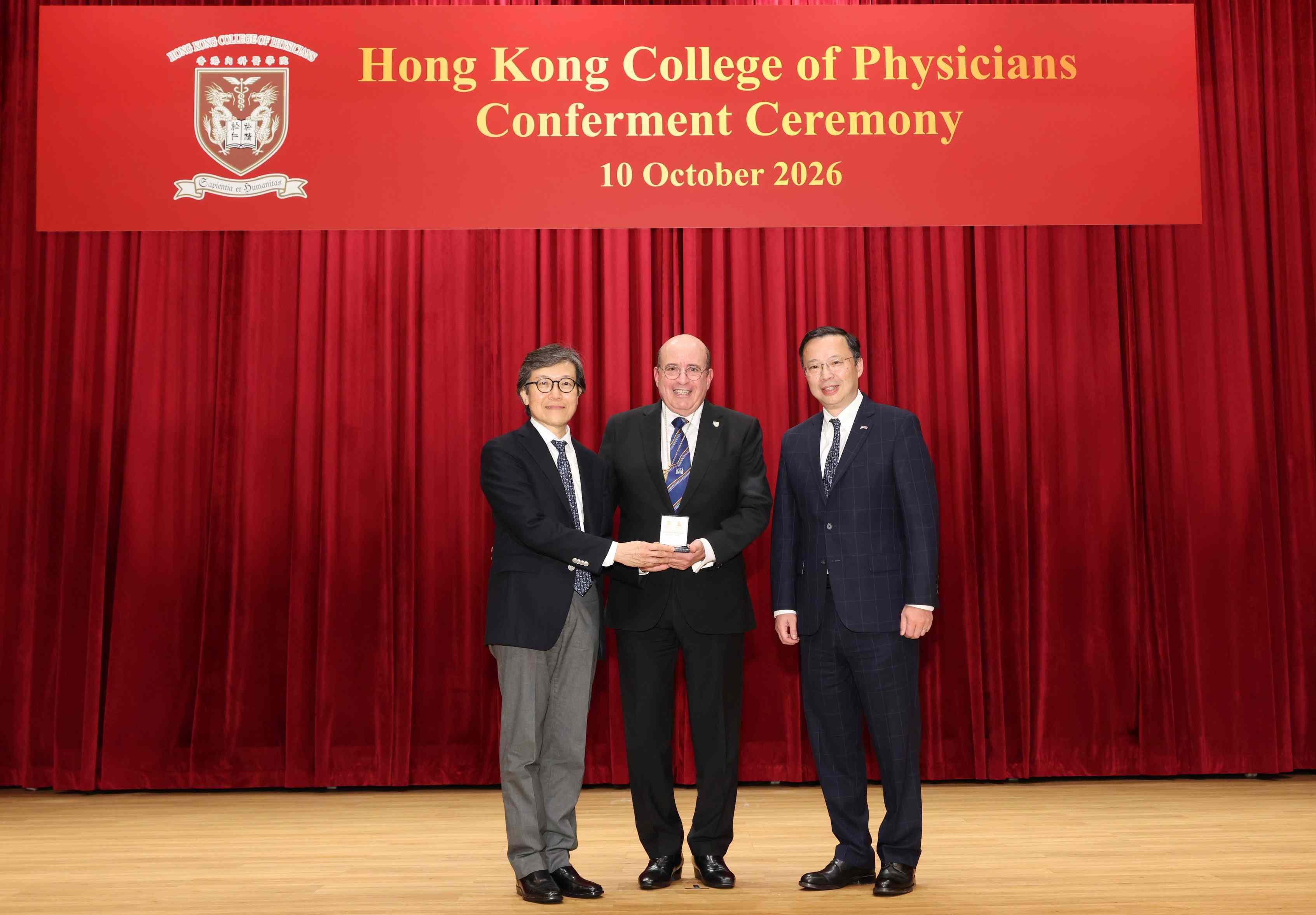 Hong Kong College of Physicians President Prof Daniel TM Chan presenting the AJS McFadzean Orator Medal to Professor Hany Eteiba, accompanied by Hong Kong College of Physicians Vice President Prof Anthony Chan